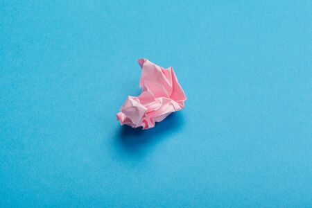 Wadded paper balls on a blue background. creative photo.