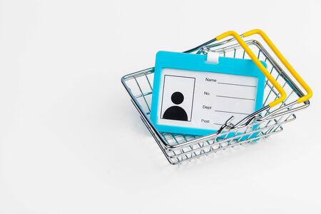 Selective focus of shopping cart or trolley with blank badge paper. creative photo.