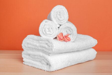 Clean soft towels on color background. creative photo.の写真素材