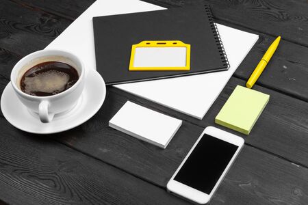 Blank corporate stationery set on wood table background. Branding mock up.