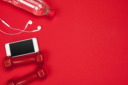 Fitness accessories on a color background. creative photo.の写真素材