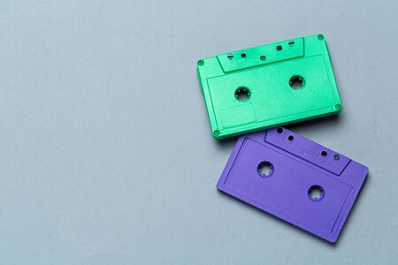 Bright retro cassette tapes on a light grey background. creative photo.の写真素材