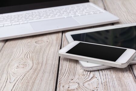 Open laptop with digital tablet on the table. creative photo.