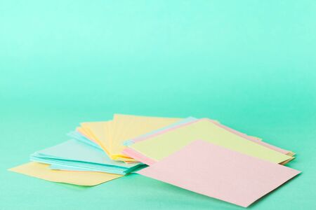 Sticky notes of bright colors close up on paper background. School or business concept. creative...