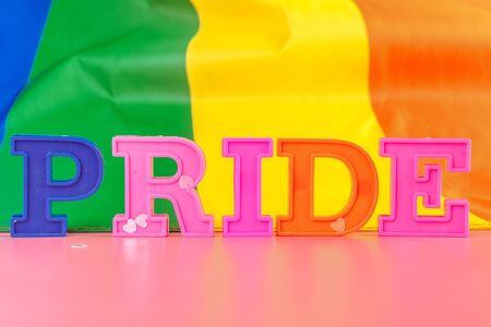 text pride, with lgbt rainbow flag. creative photo.の写真素材