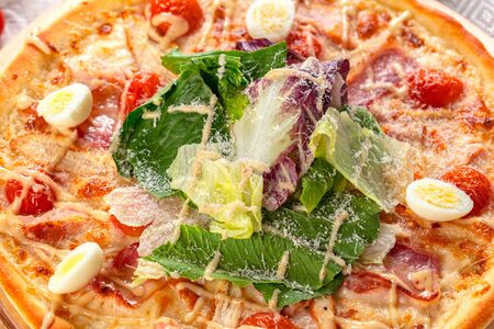 Delicious fresh pizza served on wooden table. creative photo.の写真素材
