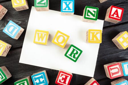 work cube with letters, sign with wooden cubes. creative photo.