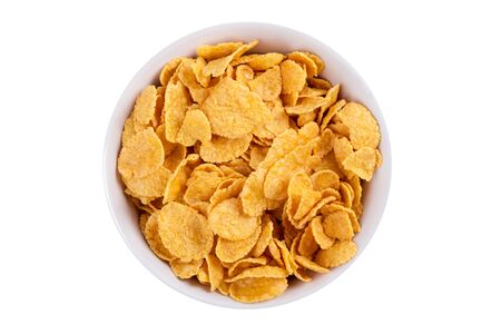 Corn flakes in a bowl isolated on white background creative photo.