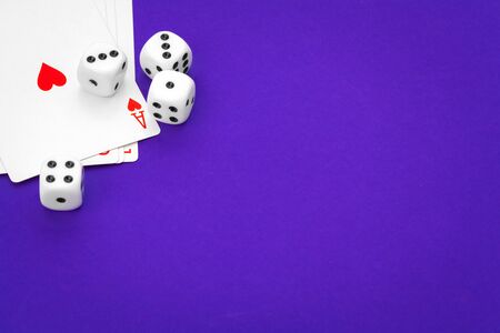 playing cards and dice on table
