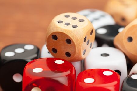 Dice on a wooden table. Concept for business risk. creative photo.の写真素材