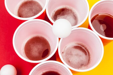 Cups for game Beer Pong on the tableの写真素材