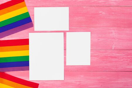 Bright rainbow gay flag on wooden background and blank spaceの写真素材
