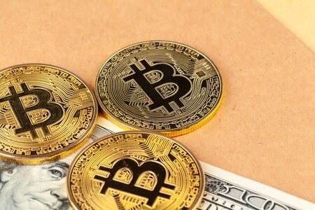 Digital crypto currency gold bitcoin and American dollars.の写真素材