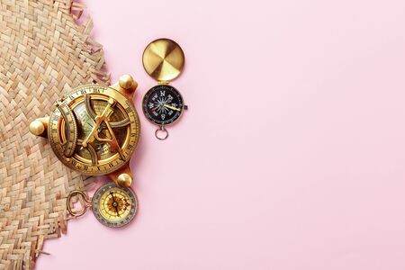 Compass on pink background, top viewの写真素材