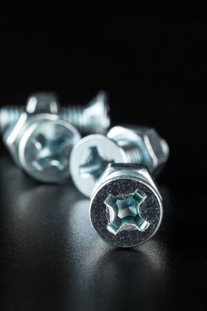 screws on black background creative photo.の写真素材
