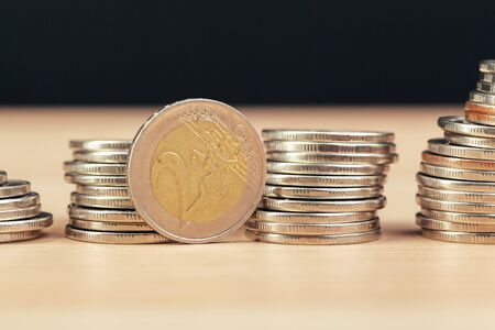 piles of coins on working table