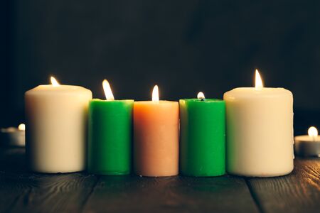 candles burning in darkness over black background. commemoration concept.の写真素材
