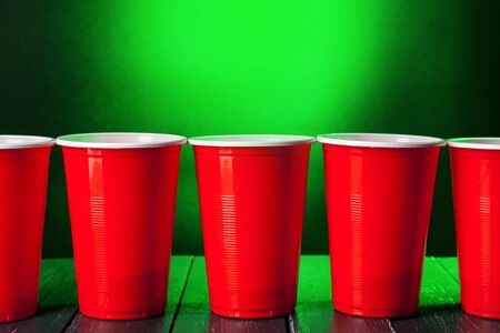 Cups for game Beer Pong on the tableの写真素材