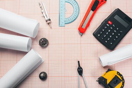 drawing tools on red graph paper with copy spaceの写真素材