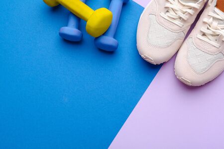 Fitness Gym equipment on color backgroundの写真素材