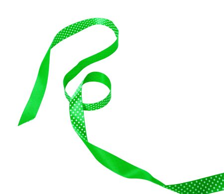 Green ribbon bow isolated on white background. Close up.の写真素材