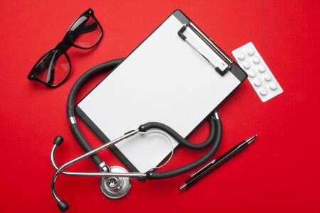 Stethoscope, clipboard and pills. Medical equipmentの写真素材