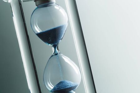 Close up hourglass on table