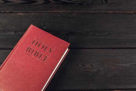 The Holy Bible on a wooden table. Close up.の写真素材
