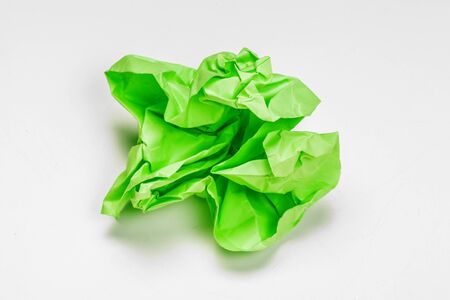 close up of a crumpled paper with curled edge on white background. Close up.の写真素材
