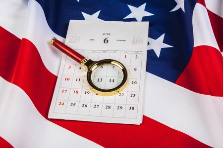 Calendar with july month on american flag. Independence day. Close up.