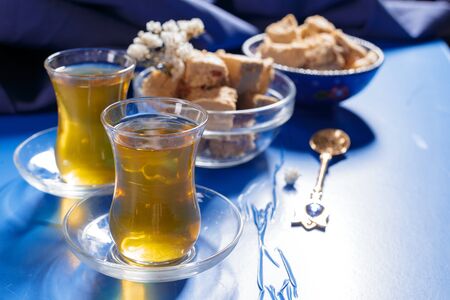 Tasty halva with tea on the table. Close up.