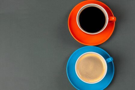 Coffee time. Bright colored composition of coffee cups. Close up.