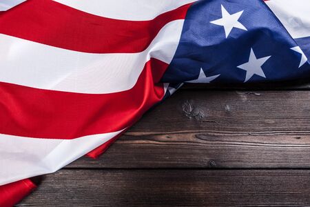 USA flag on dark wooden table background