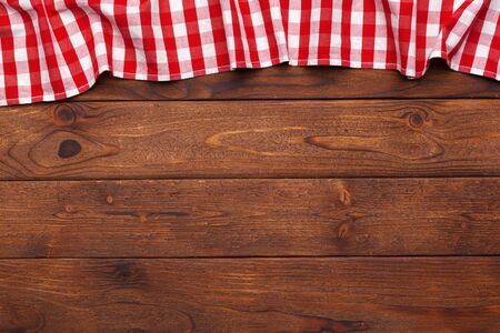 checkered tablecloth on wooden tableの写真素材