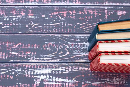 books on blue wooden background