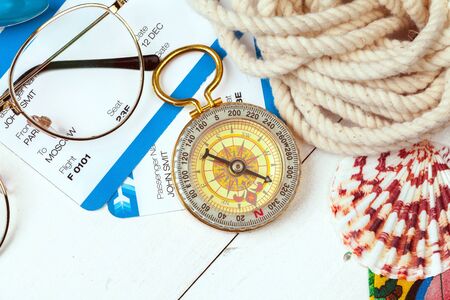 Time to Travel. Idea for tourism with tickets and compass. Close up.