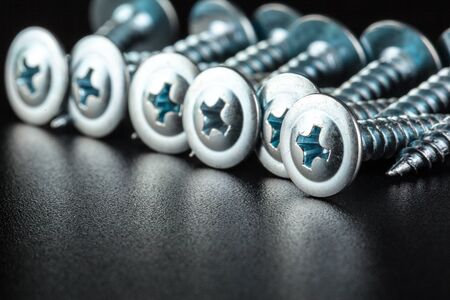 screws on black background. Macro photo. Close up.の写真素材