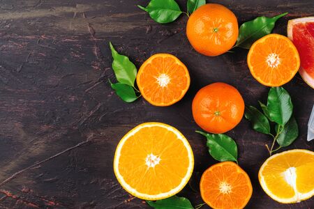 Sliced citrus fuits juicy on table close up