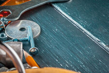 different construction tools on blue background. Close up.