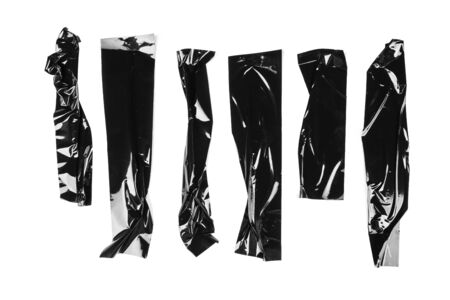 Torn different size black sticky tape, adhesive pieces