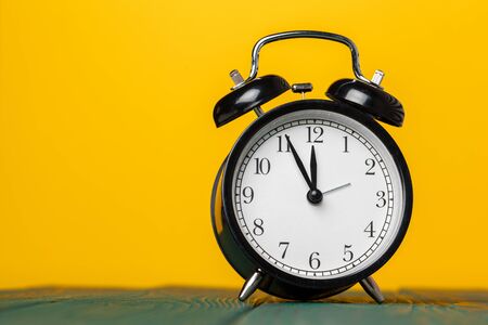 retro alarm clock on tableの写真素材