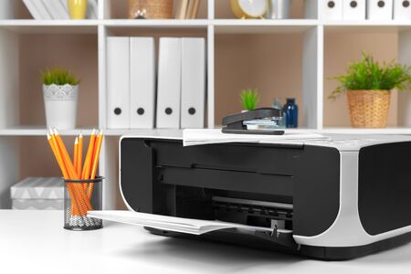 Printer, copier, scanner in office. Workplace.