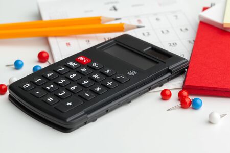 Business still life with calculator on table in office. Close up.の写真素材