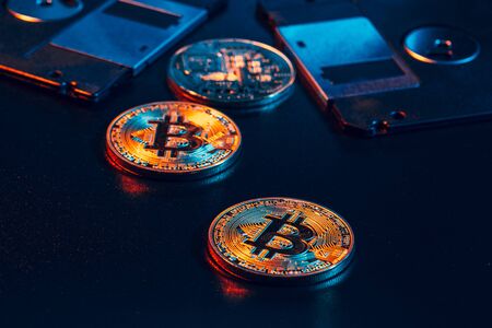 golden bitcoin on floppy disk