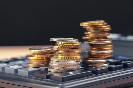 stack of coins and calculator,concept idea for business financeの写真素材