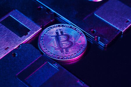 golden bitcoin on floppy disk. Close up.
