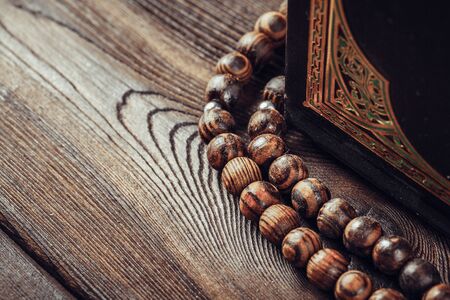 islamic holy book on wooden table. Close up.の写真素材