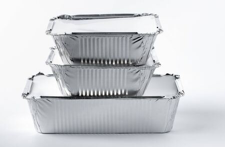Foil food box with takeaway meal on white background close upの写真素材