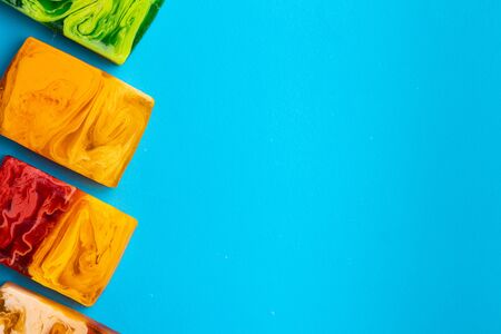 Soap for hand washing on a blue background.