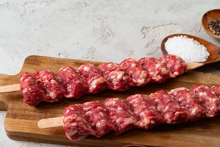 Raw turkish traditional meat kebab on the table. Close up.